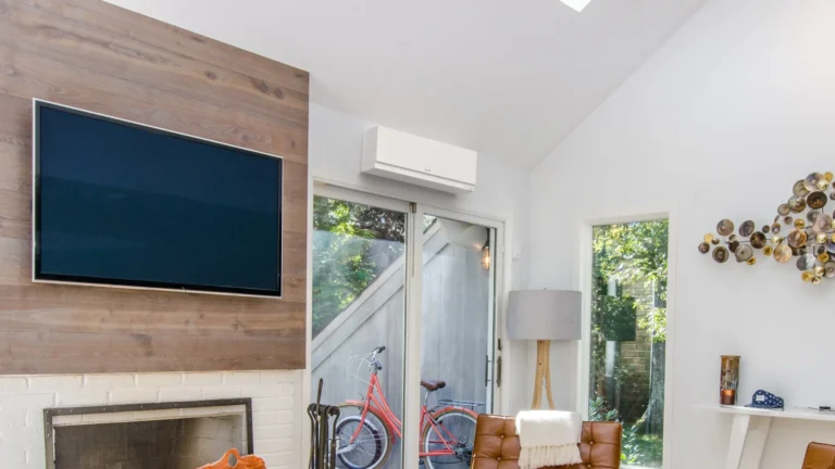 picture of Mitsubishi ductless next to TV